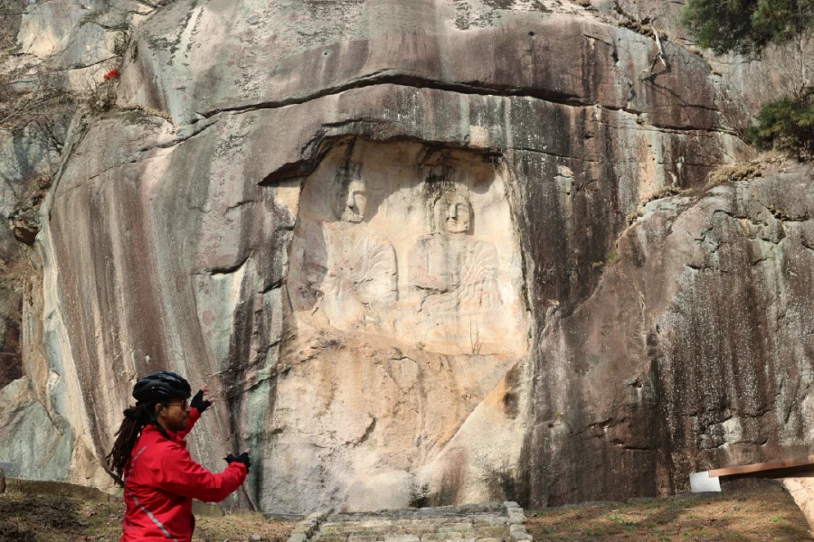 ancient buddhist carving on rock found on bike holiday korea